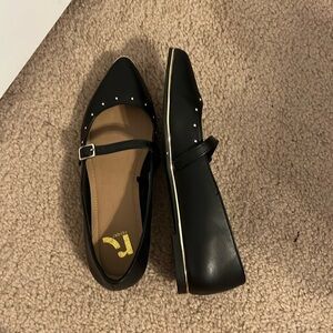 Black pointed toe flares with gold studs